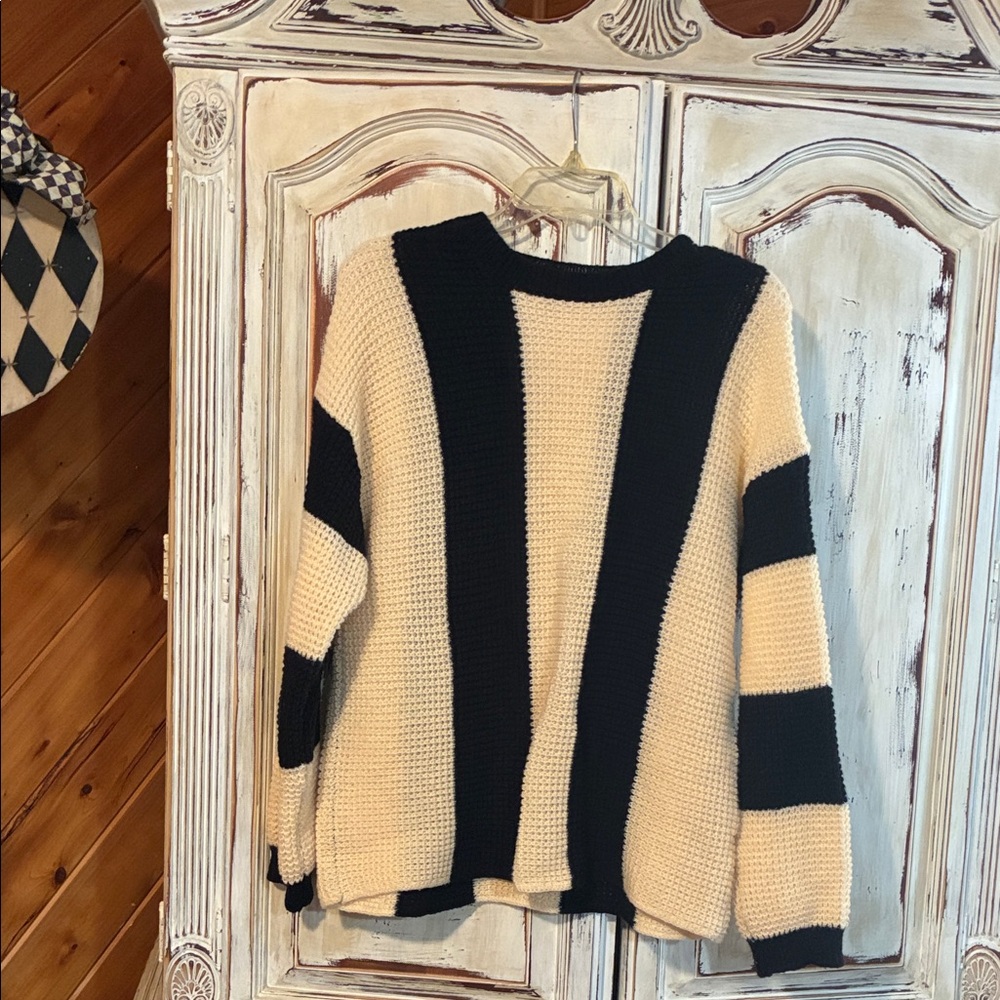 Elegant Black and Cream Striped Sweater